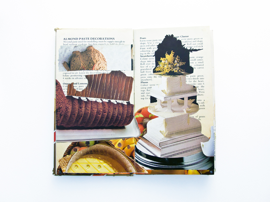 A double page spread of a recipe book with snippets of other pages of recipe books afixed in a naive collage. The pages feature the reverse of a layered cake and some brown icing.