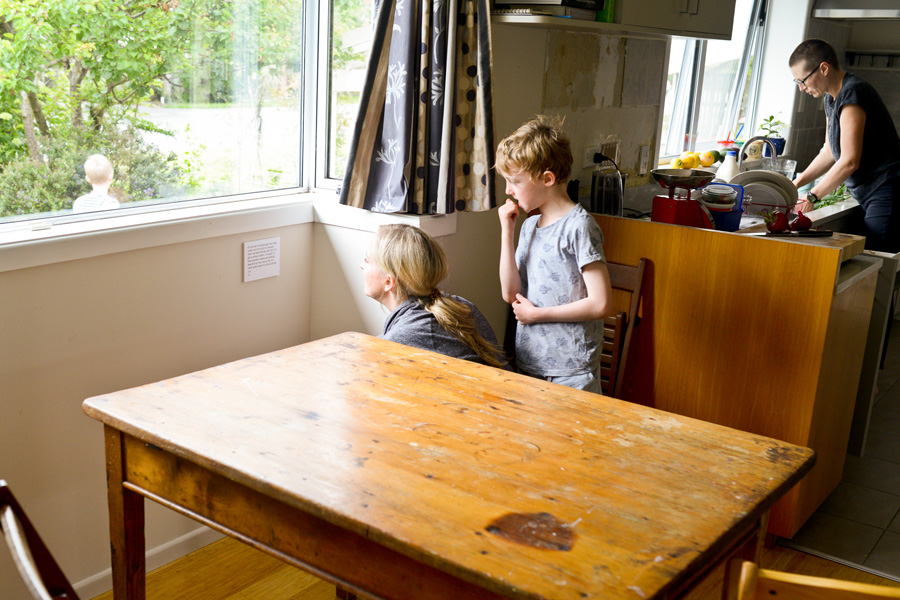 Visitors reading a label.