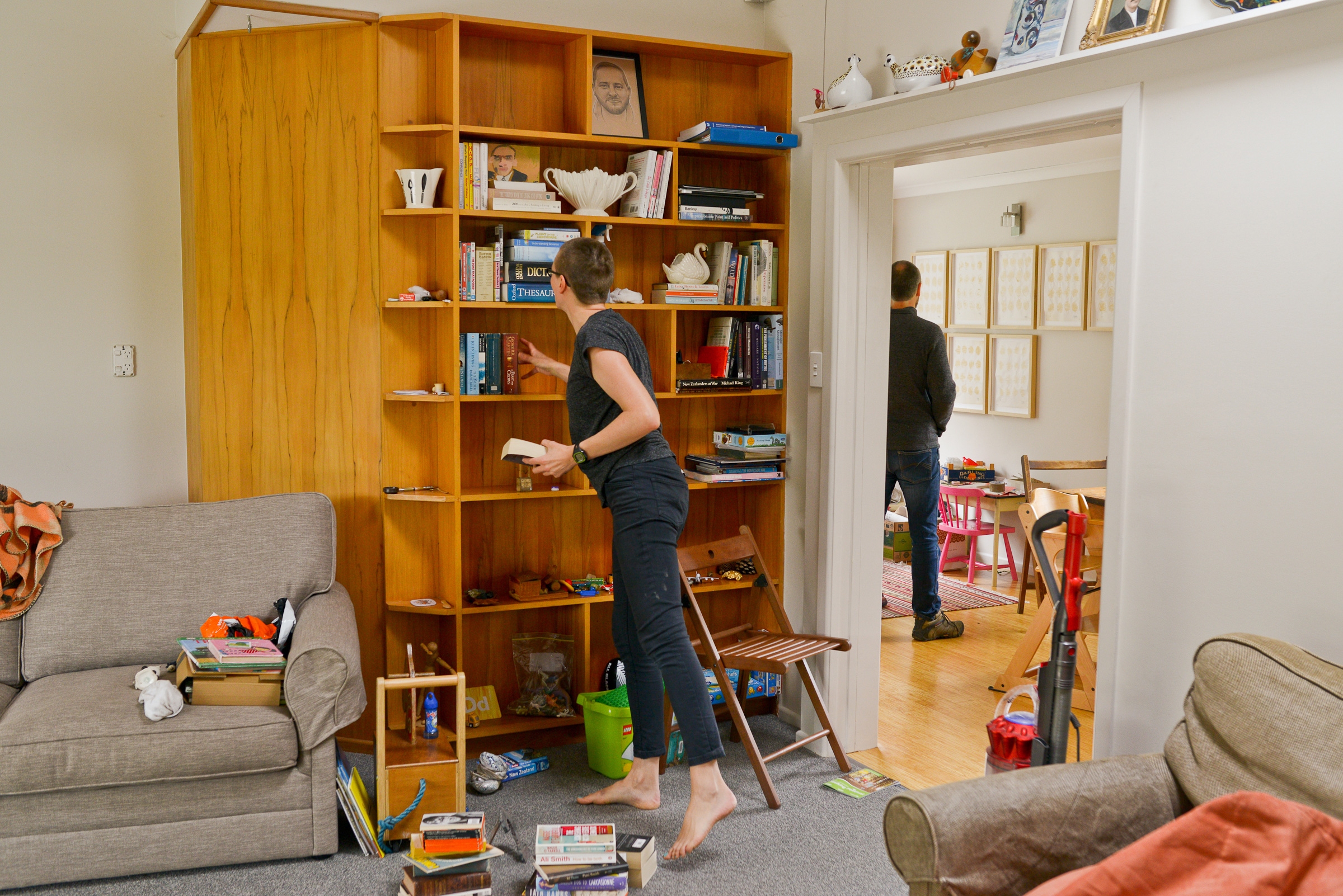 Tidying the bookshelves.